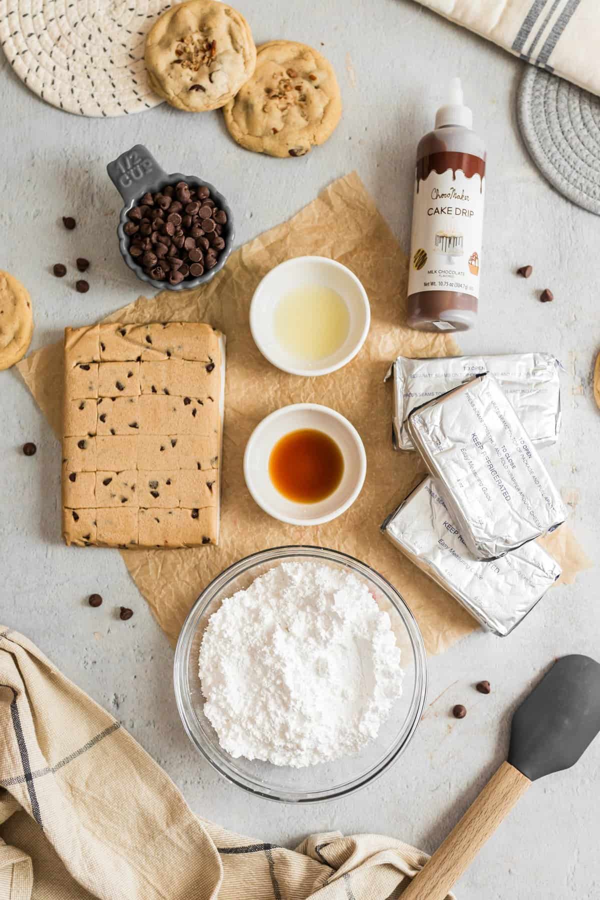 Ingredients laid out on white background with brown parchment paper in glass bowls. 
